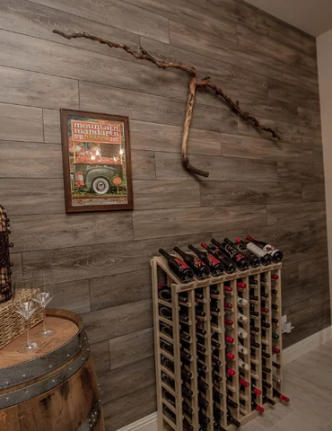 Rustic designed dining area with wine rack and vinyl feature wall | Nielson Fine Floors | Lincoln, CA
